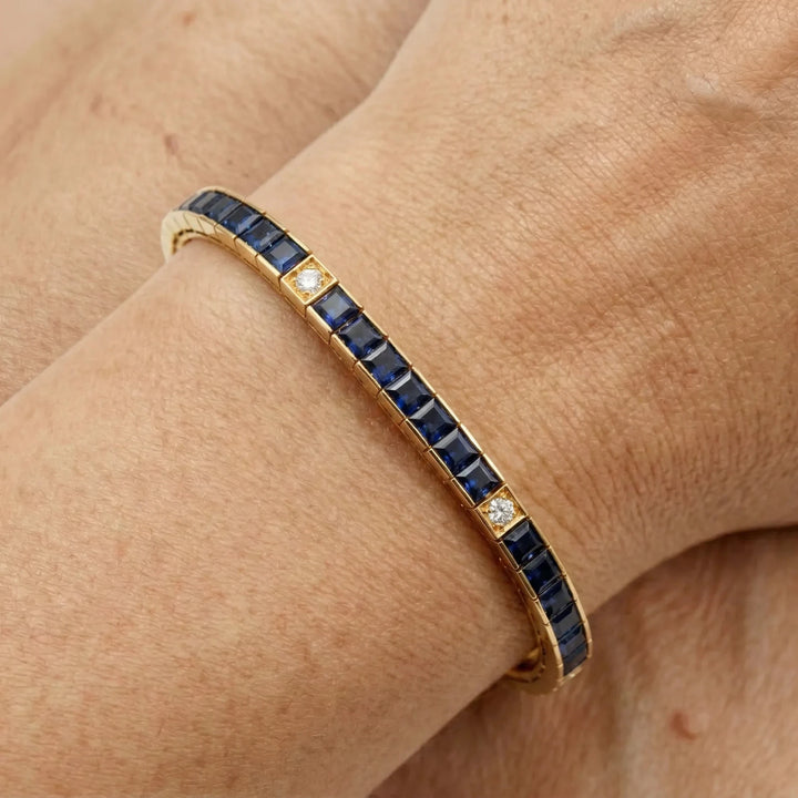 Omega Bracelet Or jaune et Pavé de saphirs