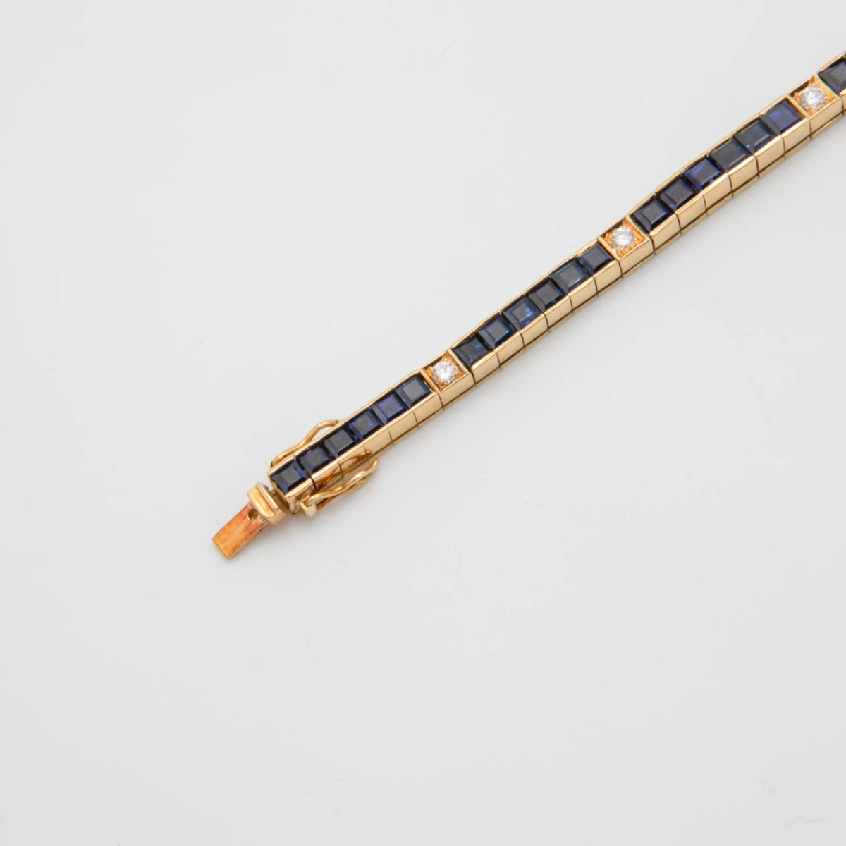 Omega Bracelet or et Pavé de saphirs